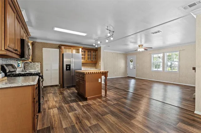 a view of a kitchen with furniture and a window