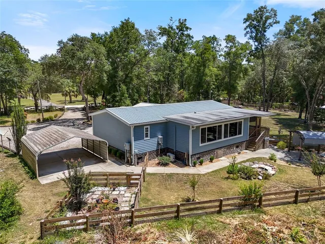 a view of a patio with chairs and a table