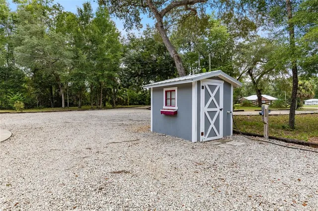 a view of a park with swings and slides