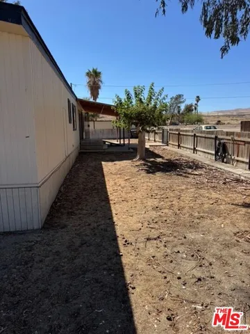 a view of balcony with furniture