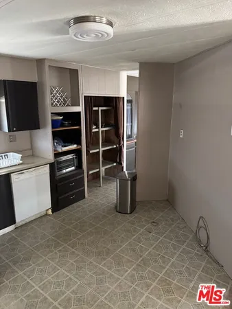 a kitchen with stainless steel appliances a stove and a refrigerator