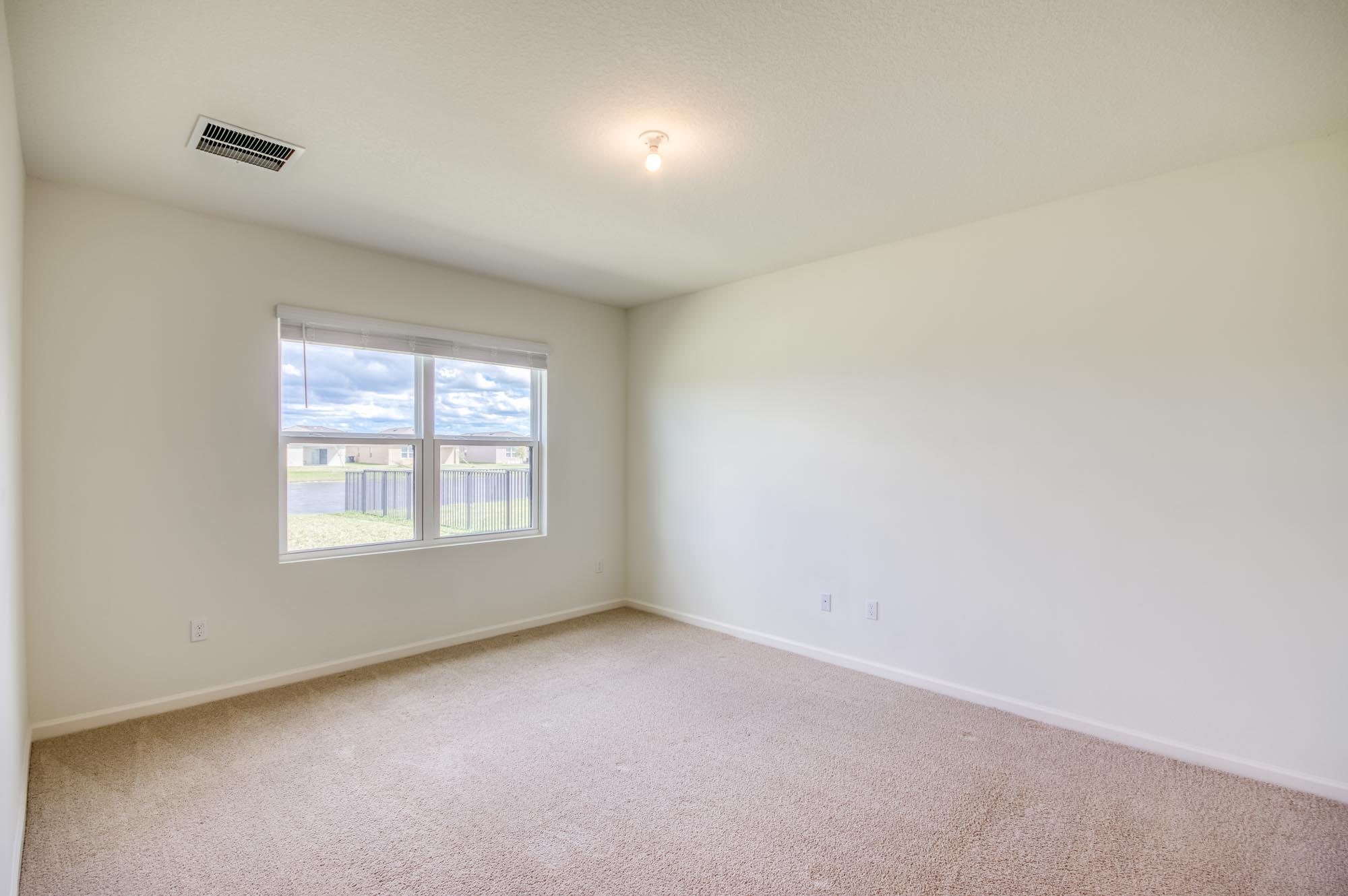 9767 Southwest Triton Way Port Port St. Lucie, FL 34987 - Photo 14 of 52 an empty room with a window