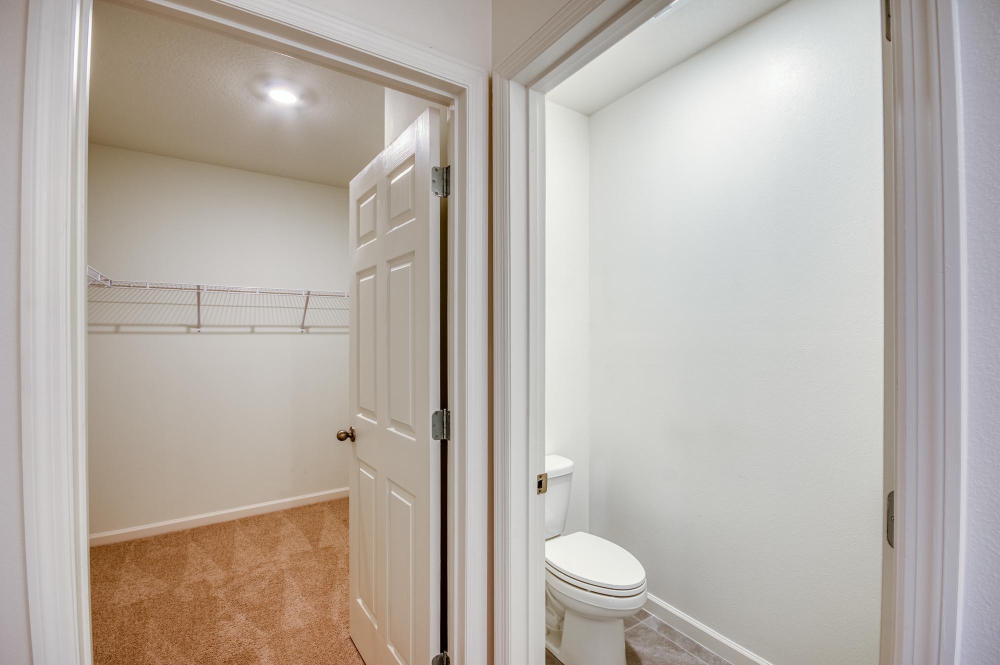 9767 Southwest Triton Way Port Port St. Lucie, FL 34987 - Photo 19 of 52 a bathroom with a granite countertop sink toilet and shower