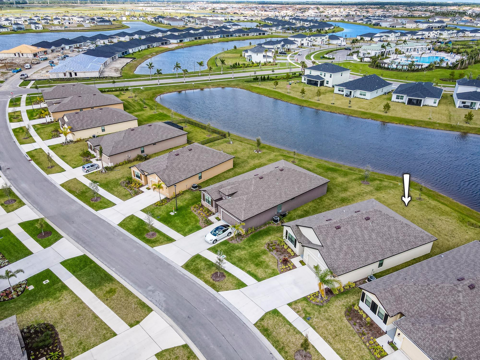 9767 Southwest Triton Way Port Port St. Lucie, FL 34987 - Photo 2 of 52 an aerial view of a house with a ocean view