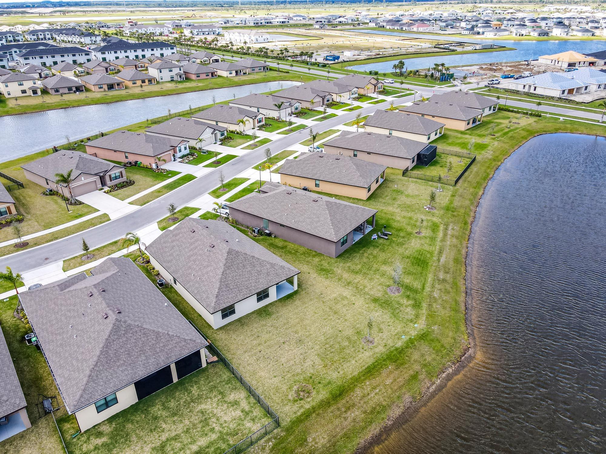 9767 Southwest Triton Way Port Port St. Lucie, FL 34987 - Photo 40 of 52 a view of a city with an ocean view