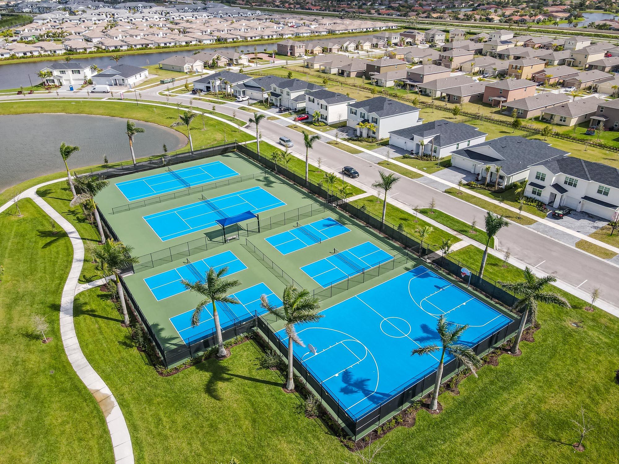 9767 Southwest Triton Way Port Port St. Lucie, FL 34987 - Photo 49 of 52 an aerial view of a tennis ground and a buildings