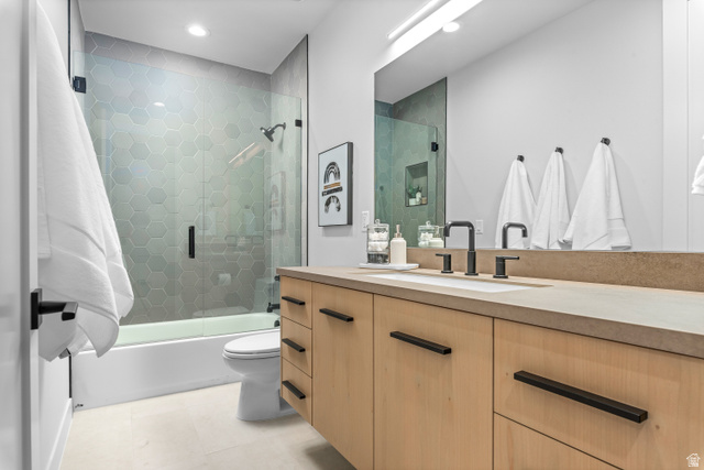 1258 Rothwell Road Park City, UT 84060 - Photo 20 of 48 Contemporary bathroom featuring a light wood-finish vanity with a stone-finish countertop and integrated sink