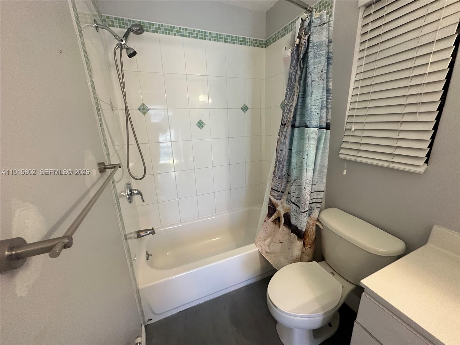 7780 Southwest 28th Street Miami, FL 33155 - Photo 27 of 54 a bathroom with a toilet and a bath tub