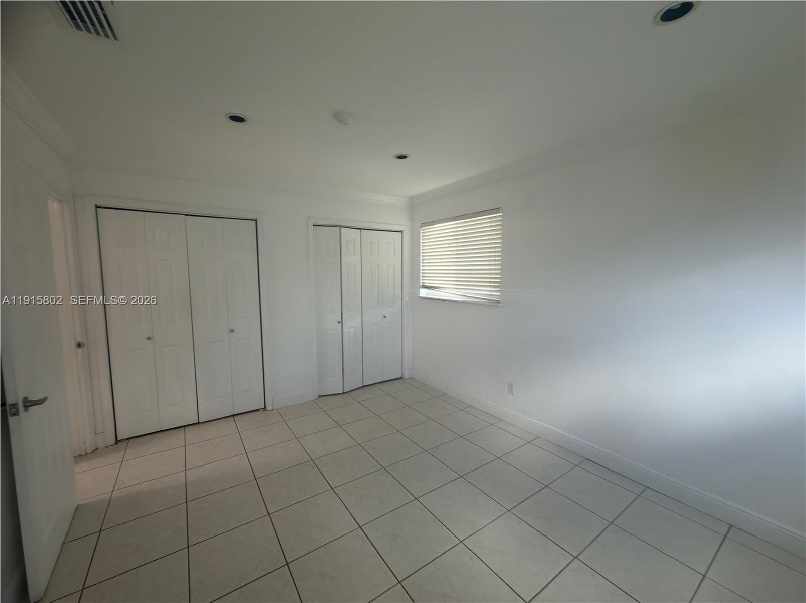 7780 Southwest 28th Street Miami, FL 33155 - Photo 32 of 54 a view of an empty room and window