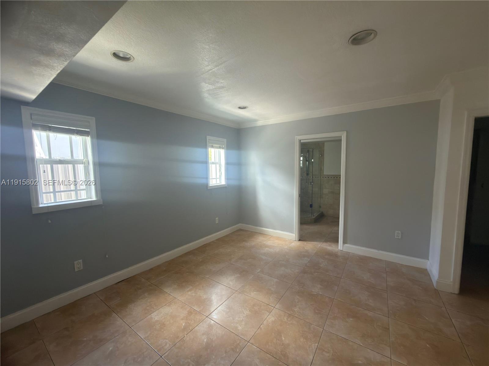 7780 Southwest 28th Street Miami, FL 33155 - Photo 37 of 54 a view of an empty room with a window