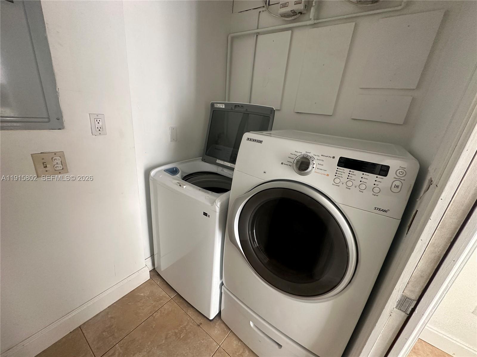 7780 Southwest 28th Street Miami, FL 33155 - Photo 39 of 54 a utility room with dryer and washer