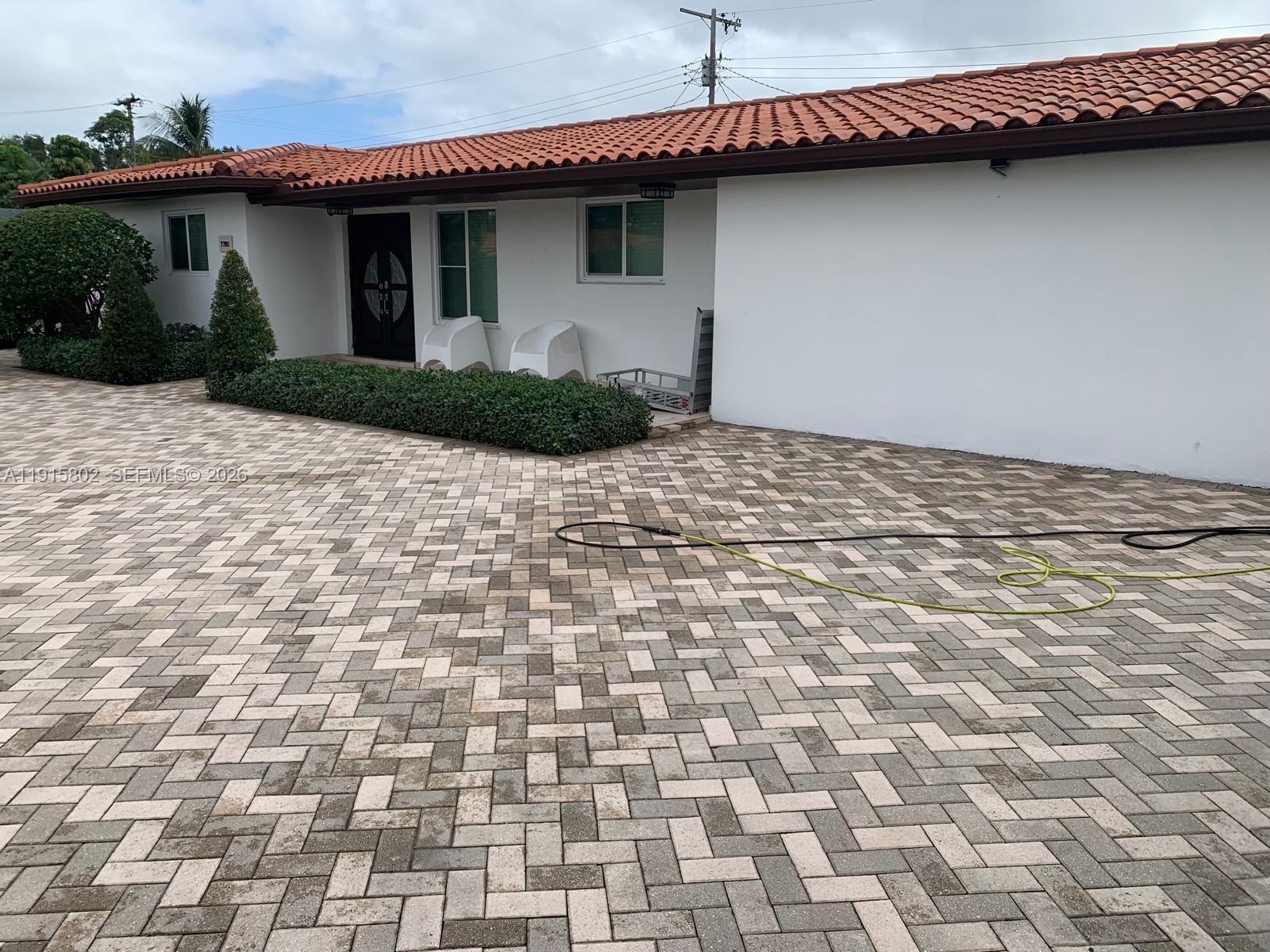 7780 Southwest 28th Street Miami, FL 33155 - Photo 4 of 54 a view of a house with a outdoor space