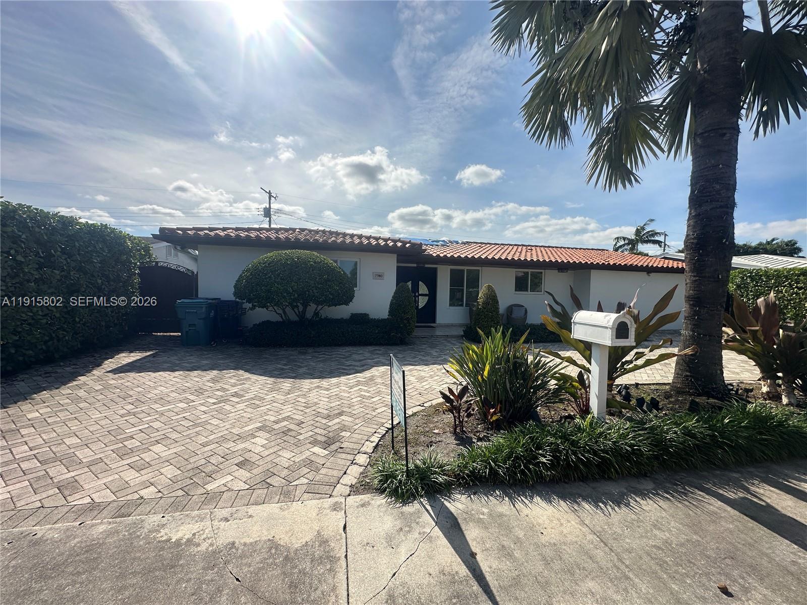 7780 Southwest 28th Street Miami, FL 33155 - Photo 5 of 54 a backyard of a house with table and chairs potted plants