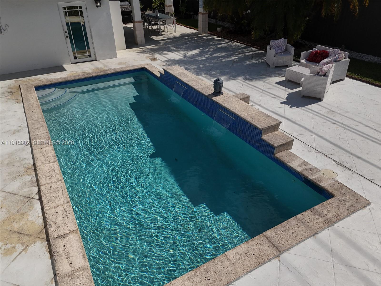 7780 Southwest 28th Street Miami, FL 33155 - Photo 7 of 54 a view of a backyard of the house