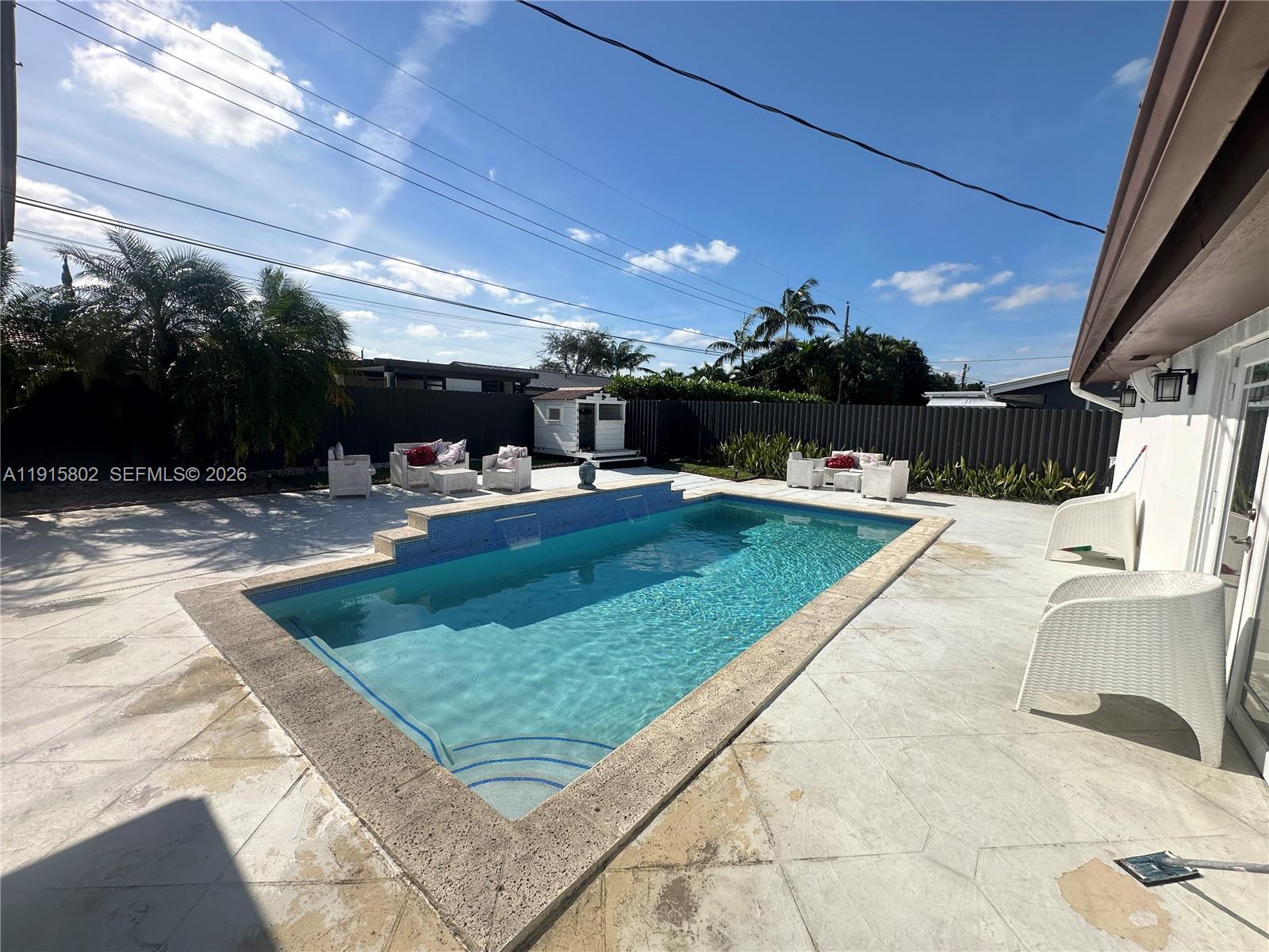 7780 Southwest 28th Street Miami, FL 33155 - Photo 9 of 54 a view of a swimming pool with a patio