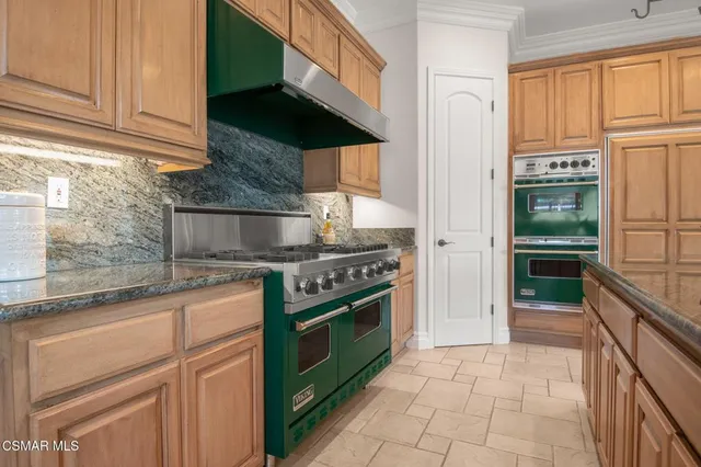 a en suite bathroom with a double vanity sink a mirror and a shower