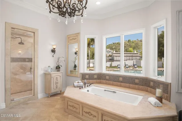 an aerial view of a house with a yard and lake view