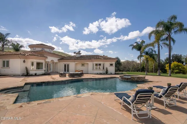 an aerial view of residential house with outdoor space