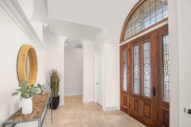 a living room with furniture a window and a fireplace