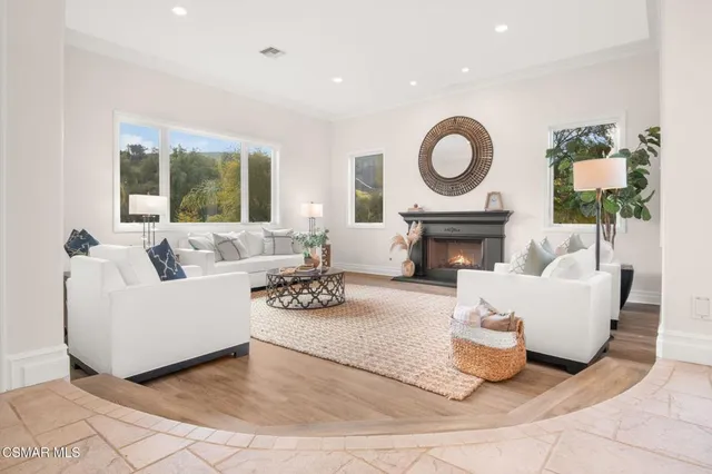 a dining room with furniture and wooden floor