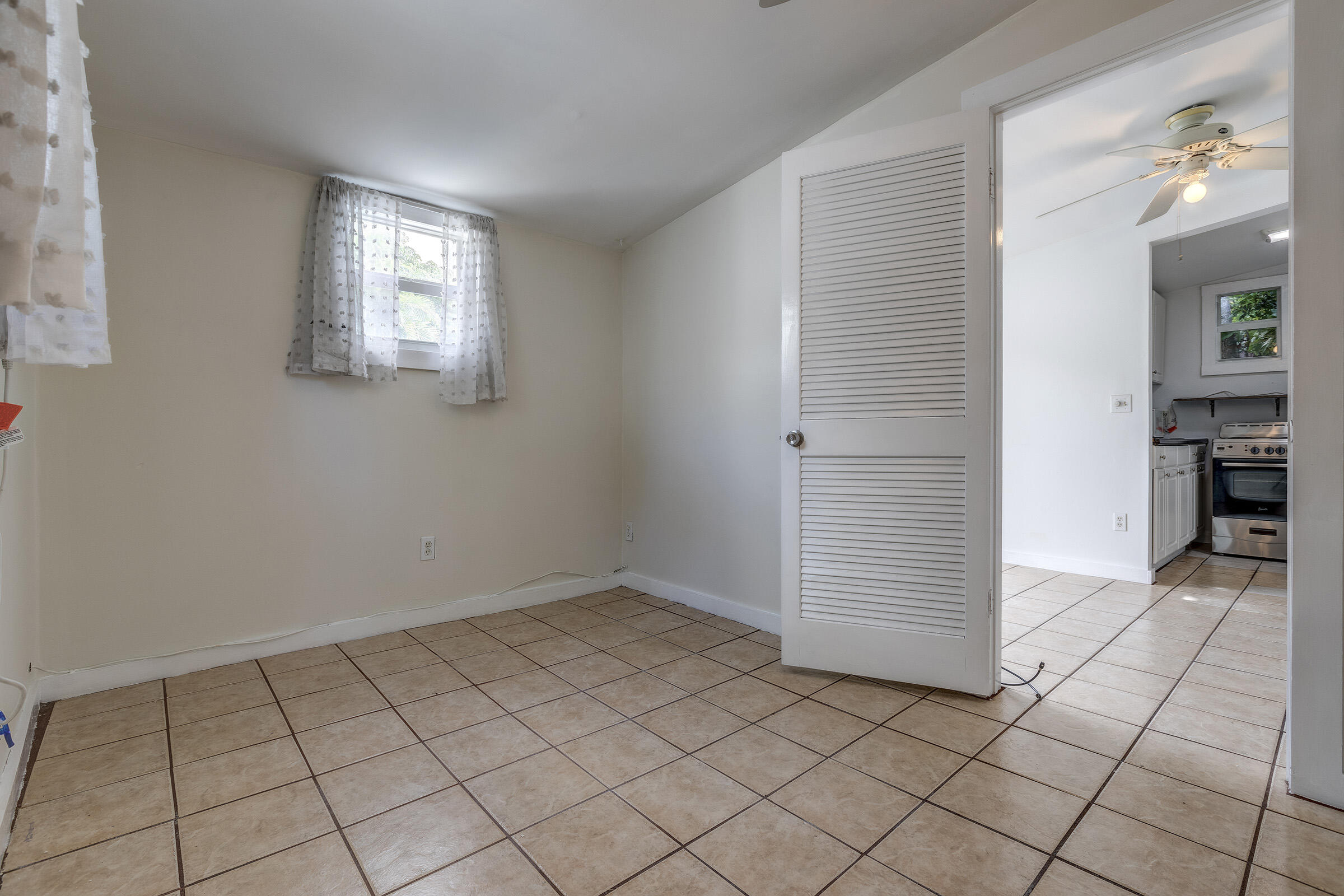 1318 Duncan Street, Unit 3 Key West, FL 33040 - Photo 8 of 10 an empty room with windows