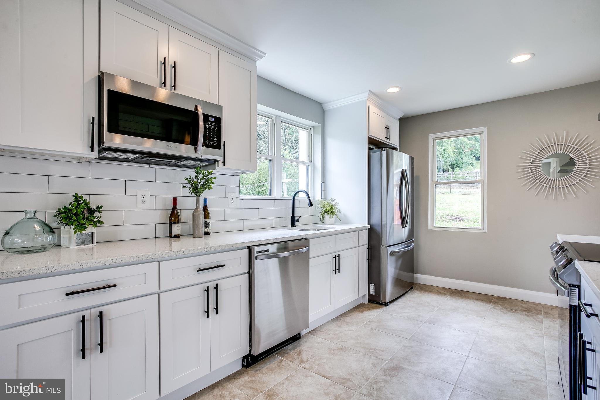 1526 Ridge Road Whiteford, MD 21160 - Photo 13 of 32 Built in Microwave and Tile Backsplash