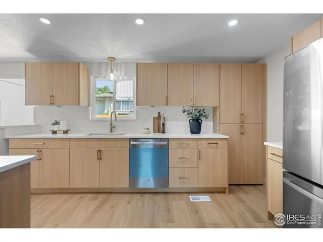 a kitchen with sink cabinets and window