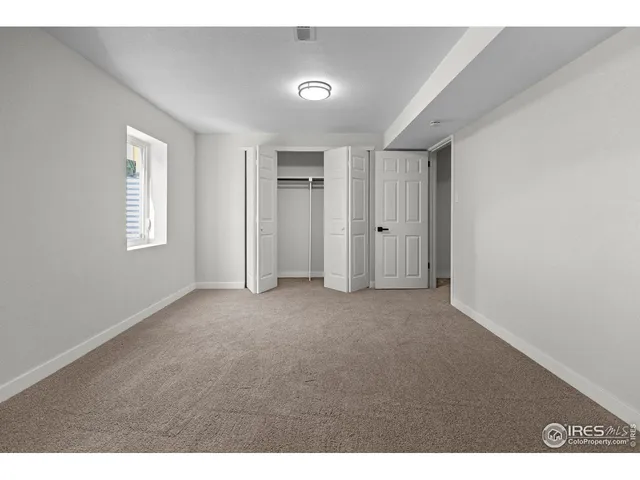 a view of empty room with windows