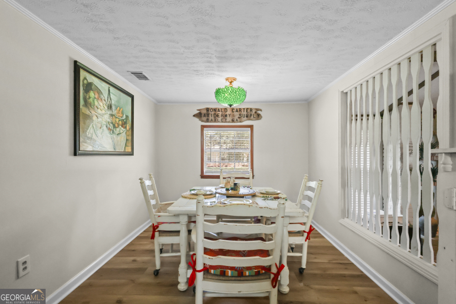 780 David Carter Road Baxley, GA 31513 - Photo 15 of 35 a view of a dining room with furniture window and wooden floor