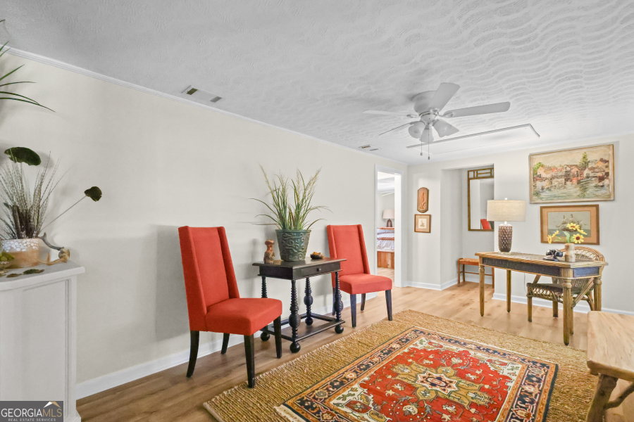 780 David Carter Road Baxley, GA 31513 - Photo 17 of 35 a living room with furniture a rug potted plant and a table