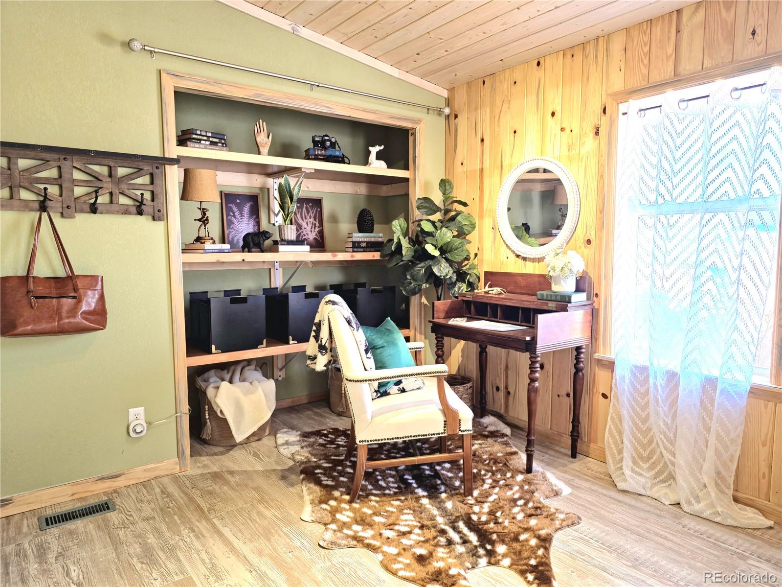 891 South Mountain Estates Road Florissant, CO 80816 - Photo 21 of 43 a living room filled with furniture
