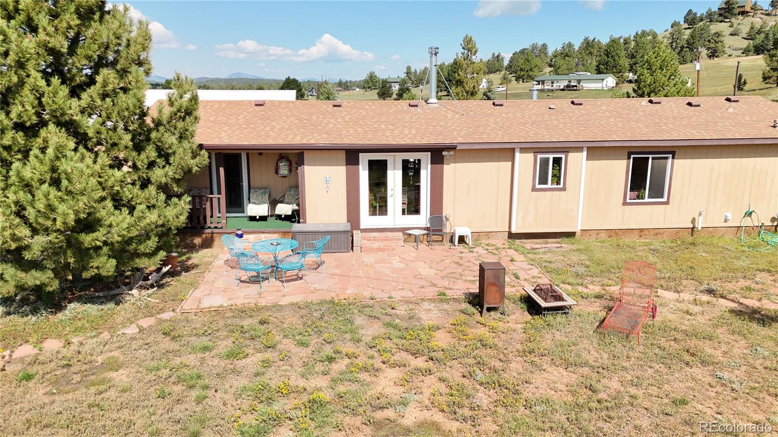 891 South Mountain Estates Road Florissant, CO 80816 - Photo 29 of 43 a view of a house with a patio