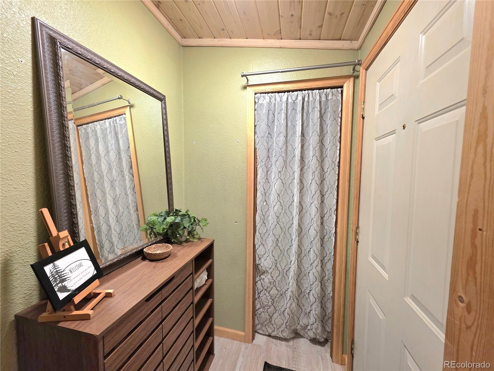 891 South Mountain Estates Road Florissant, CO 80816 - Photo 10 of 43 a view of room with window and furniture