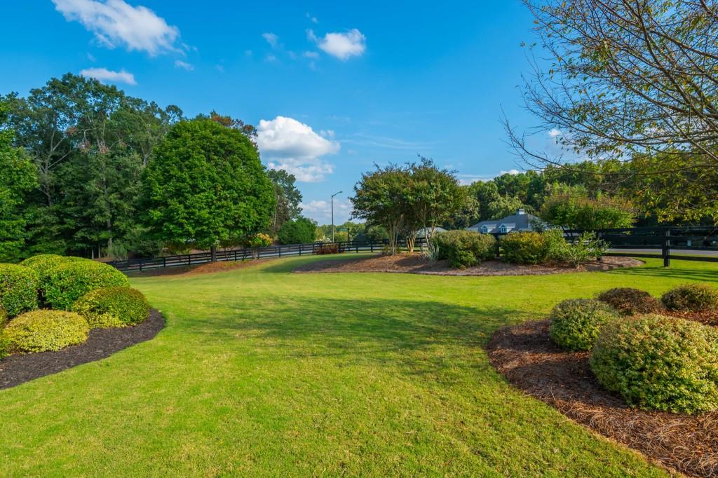 220 Edwards Brook Court Canton, GA 30115 - Photo 12 of 77 a view of a garden with lawn chairs