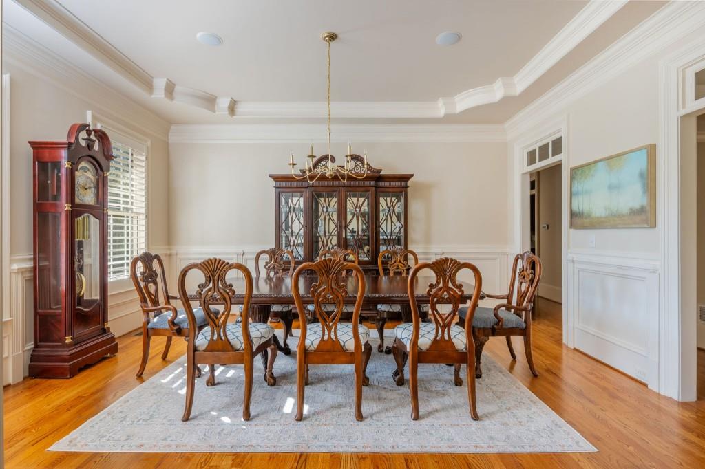 220 Edwards Brook Court Canton, GA 30115 - Photo 16 of 77 a view of a dining room with furniture and wooden floor