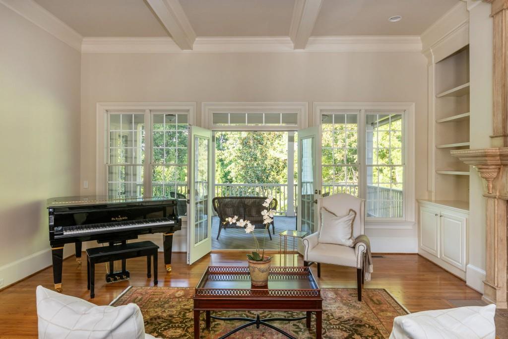 220 Edwards Brook Court Canton, GA 30115 - Photo 17 of 77 a living room with furniture and a floor to ceiling window