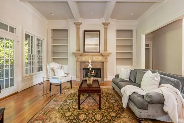 a kitchen with stainless steel appliances granite countertop a stove a sink dishwasher and a microwave oven with wooden floor