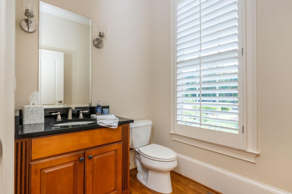 220 Edwards Brook Court Canton, GA 30115 - Photo 23 of 77 a bathroom with a granite countertop sink toilet and mirror