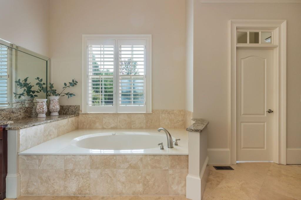 220 Edwards Brook Court Canton, GA 30115 - Photo 37 of 77 a bath tub sitting in a bathroom next to a window