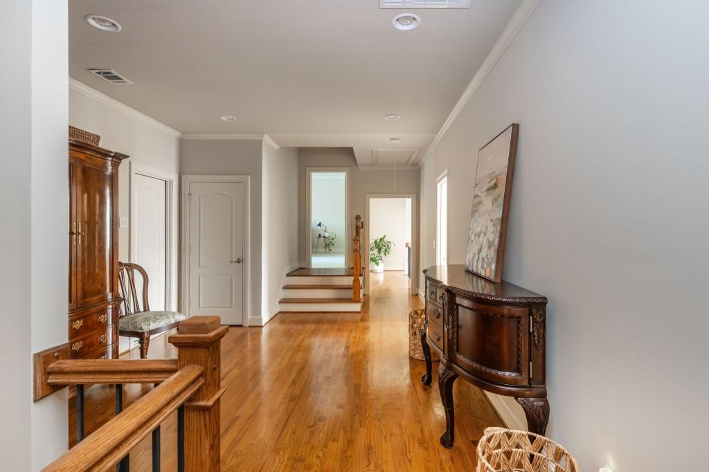 220 Edwards Brook Court Canton, GA 30115 - Photo 41 of 77 a view of a hallway with wooden floor and furniture