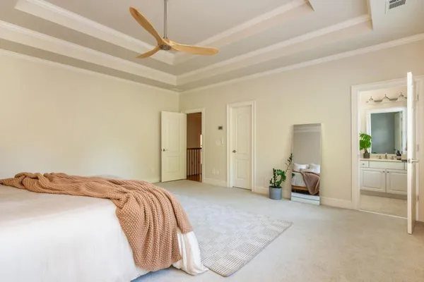 an aerial view of a house with a backyard