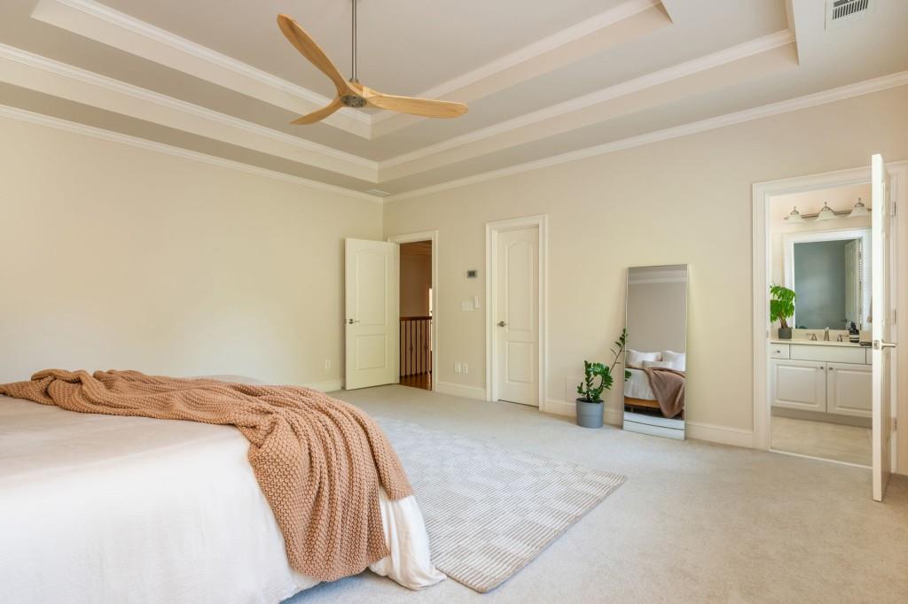 220 Edwards Brook Court Canton, GA 30115 - Photo 45 of 77 a bedroom with a bed and a couch