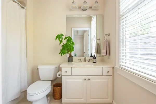 an aerial view of a house with outdoor space and a lake view