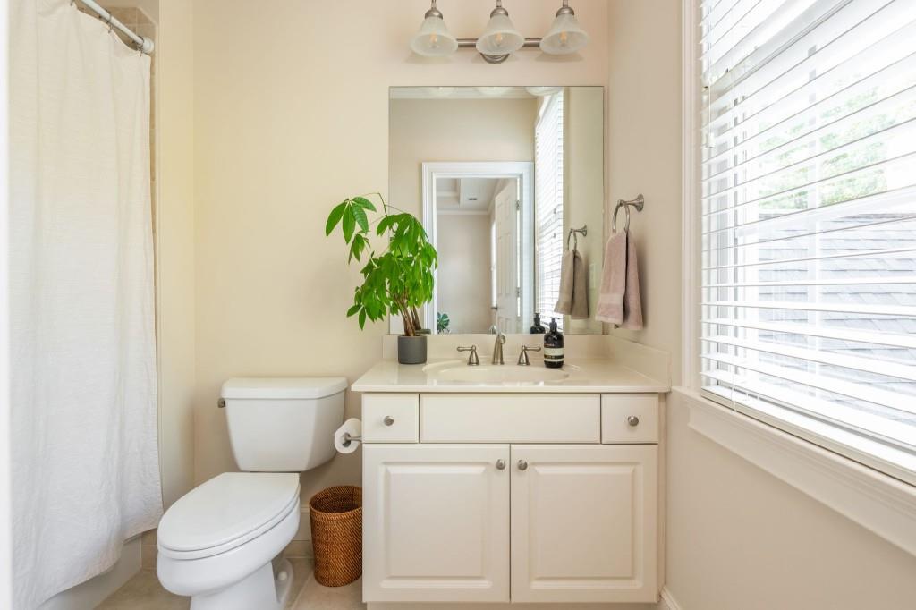 220 Edwards Brook Court Canton, GA 30115 - Photo 46 of 77 a bathroom with a toilet sink and mirror