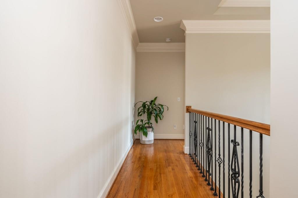 220 Edwards Brook Court Canton, GA 30115 - Photo 47 of 77 a view of a hallway with wooden floor