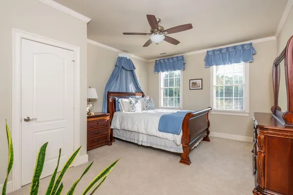 a view of a swimming pool with a table and chairs