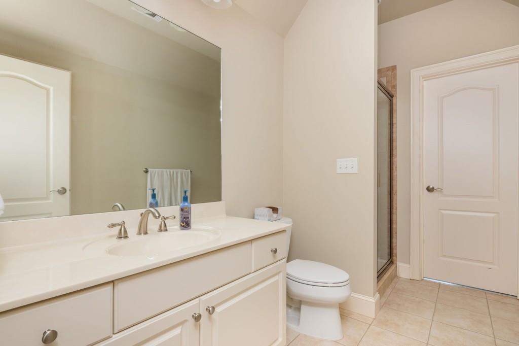 220 Edwards Brook Court Canton, GA 30115 - Photo 53 of 77 a bathroom with a sink a toilet and shower