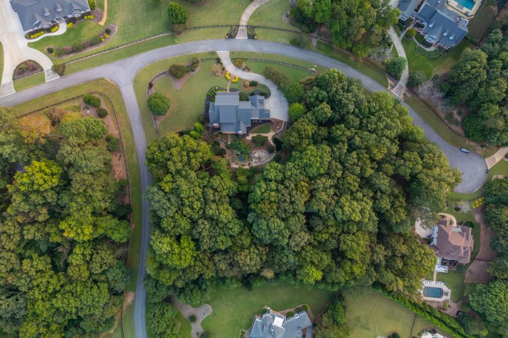220 Edwards Brook Court Canton, GA 30115 - Photo 73 of 77 an aerial view of a house with a lake view