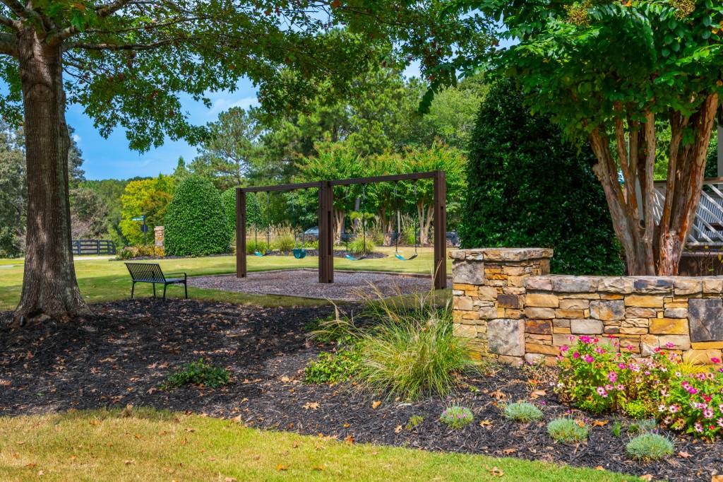 220 Edwards Brook Court Canton, GA 30115 - Photo 75 of 77 a view of a yard with plants and trees