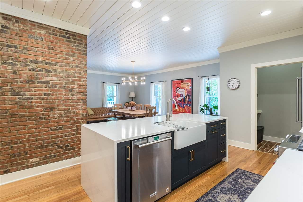 11809 Appaloosa Run East Raleigh, NC 27613 - Photo 13 of 30 This fabulous working island features beautiful quartz counter tops, a white farmhouse sink, stainless steel dishwasher and a built-in trash bin. The recessed lighting above the island provides plenty of light during food preparation. Kitchen